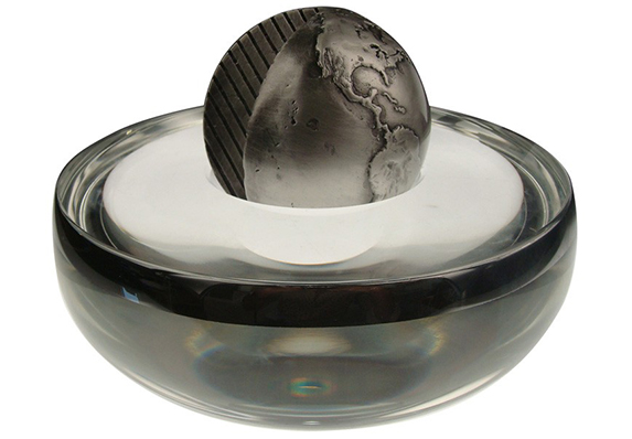 large heavy custom crystal bowl with silver rim and custom cast globe with leaf pattern cut out